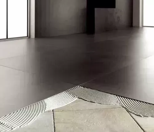 Installing tiles over existing floor tiles