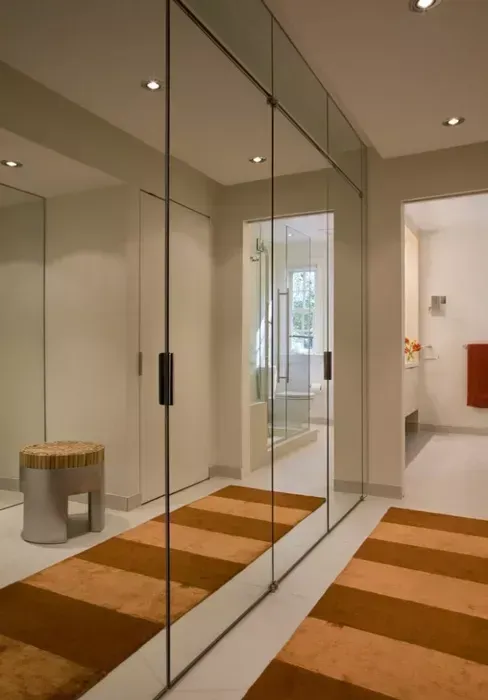 Mirrored cabinet doors in bedroom