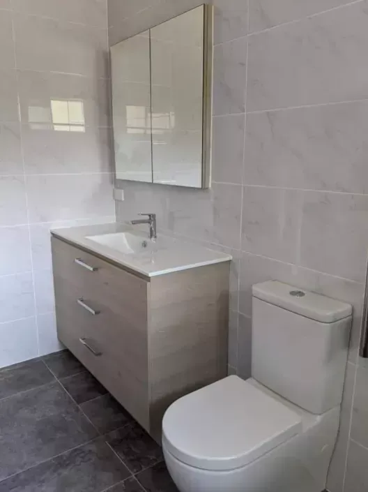 Bathroom featuring Cement 36DG Floor and Campania Carrara Walls